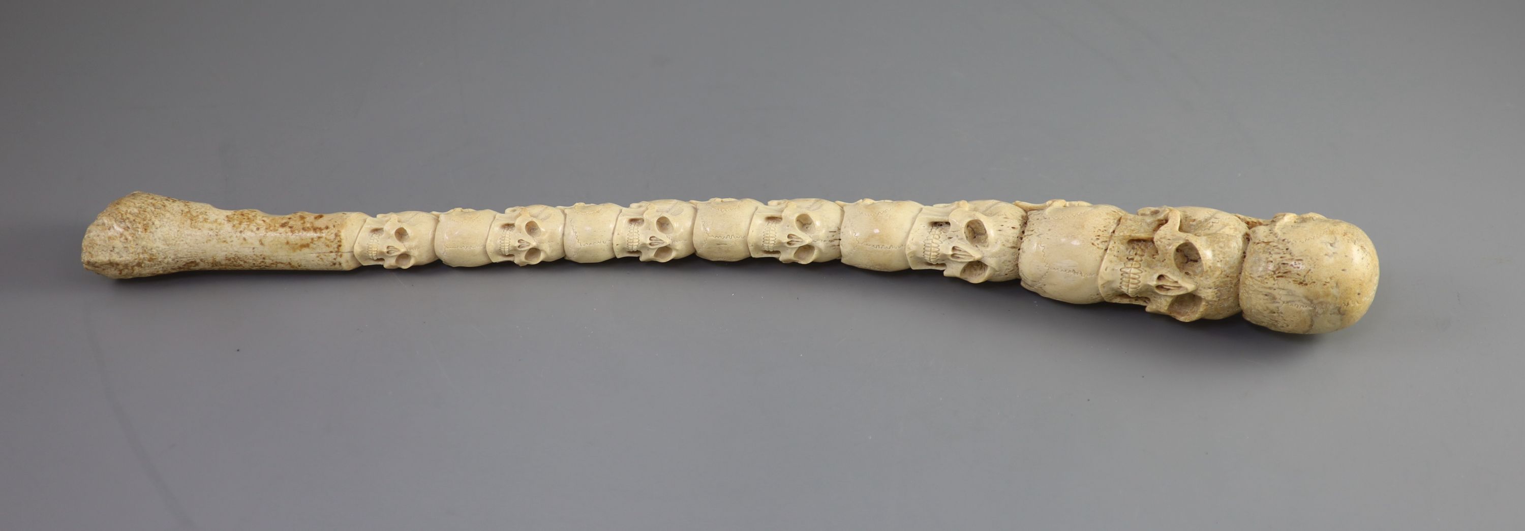 A unusual Inuit ‘skull’ carved walrus baculum, believed to be 19th century, 49.5 cm long